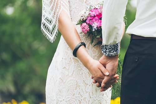 wedding groom and bride holding hands hand